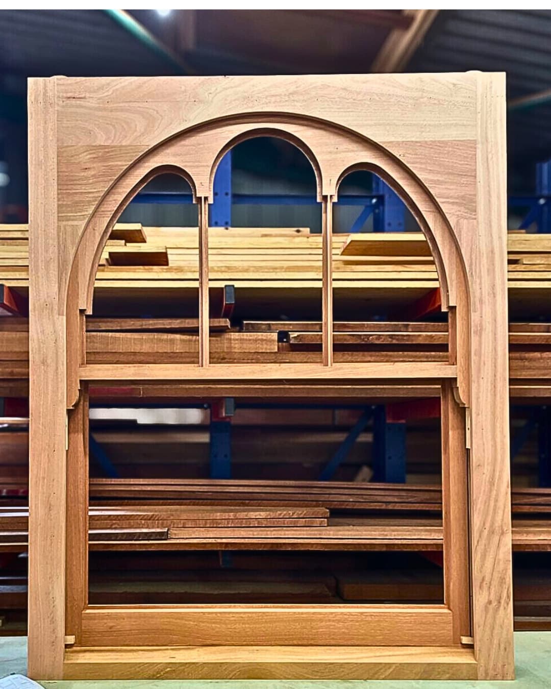 Unpainted arched gothic sash in the LSWD workshop timber store